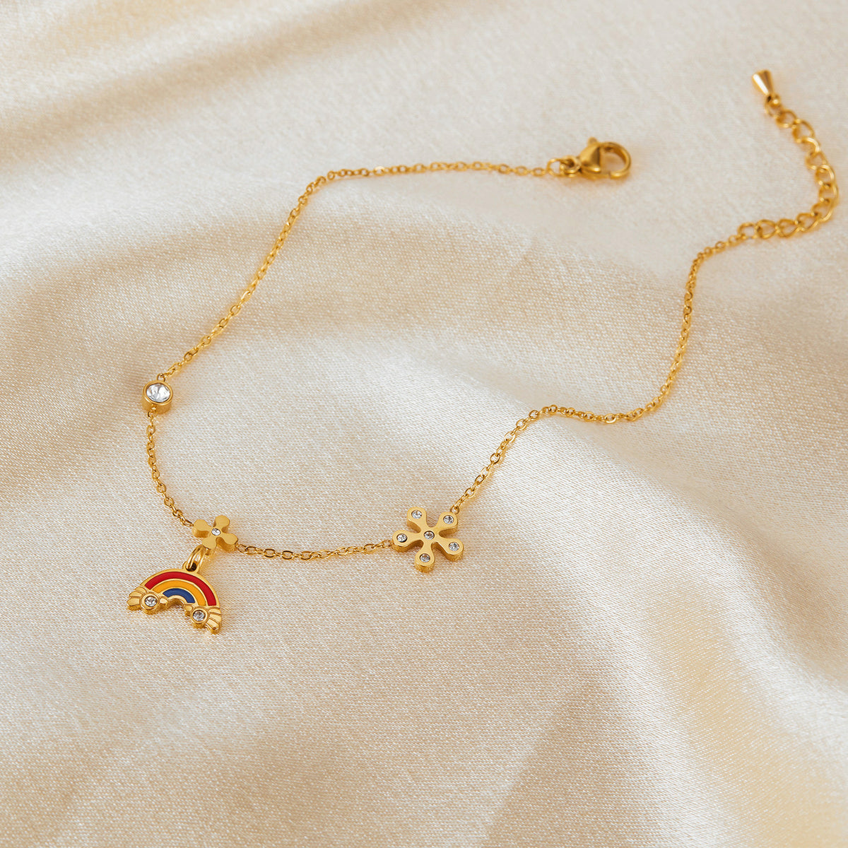 Gold-tone stainless steel with clear crystal stones
