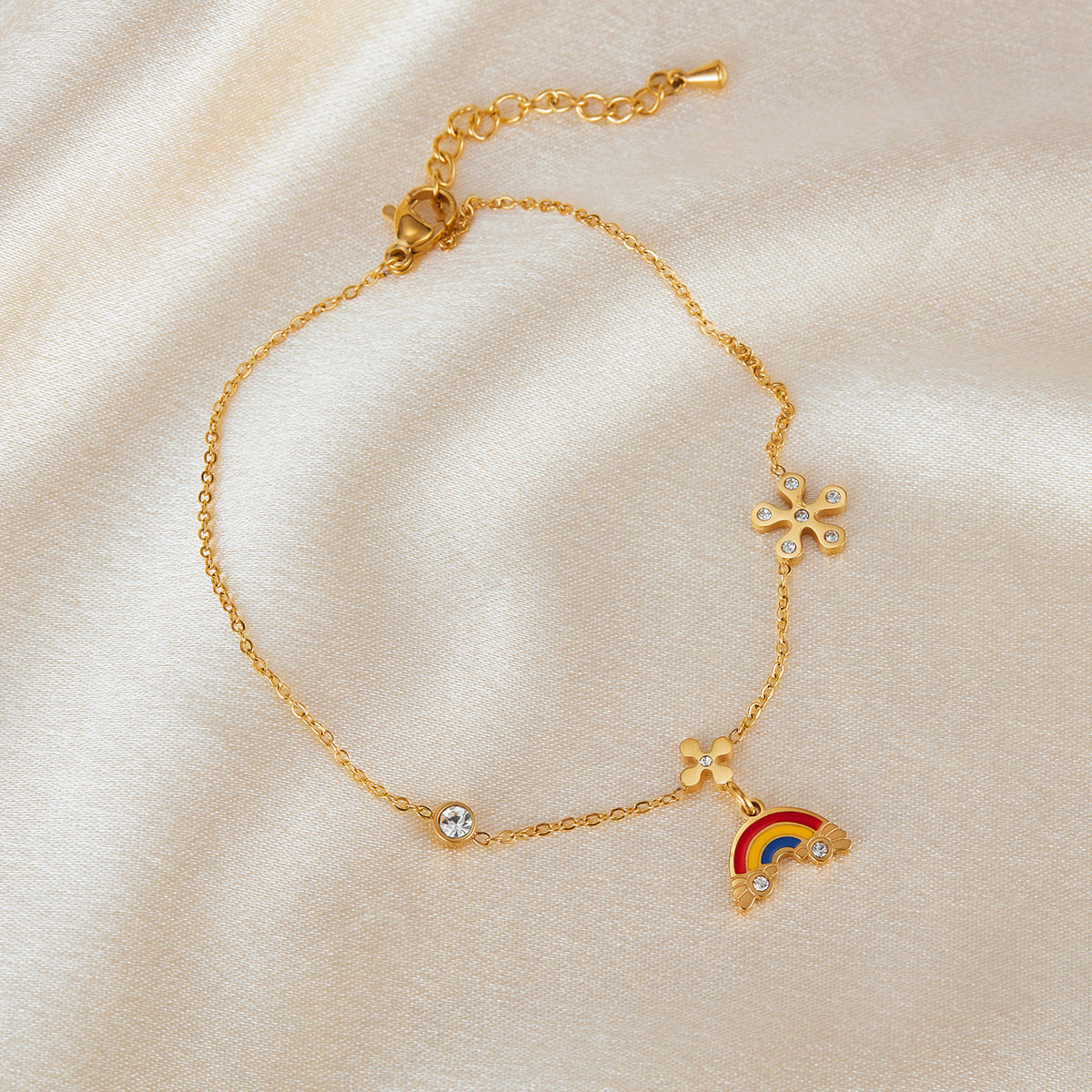Gold-tone stainless steel with clear crystal stones